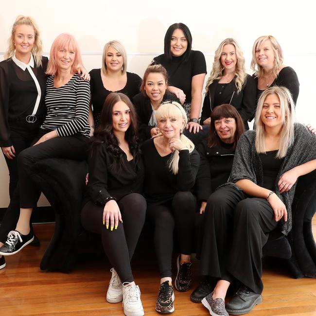 Owner Julie Farragher (front, centre) with staff members at Pandora’s Hair. Picture: Sue Graham