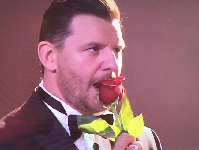 Manu seems a little to satisfied with his rose.