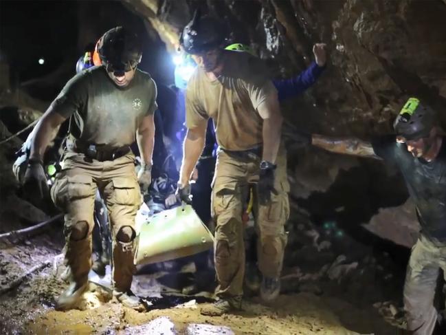 Rescue personnel carrying a member of the Wild Boars Thai soccer team out on a stretcher in Khun Nam Nang Non Forest Park in the Mae Sai district. Picture: AFP