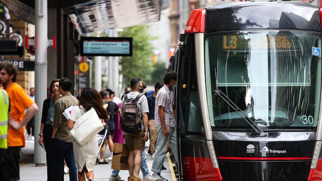 Commuters lining up for the tram near Wynyard Station as the rail strike causes havoc. Picture: NCA Newswire / Gaye Gerard