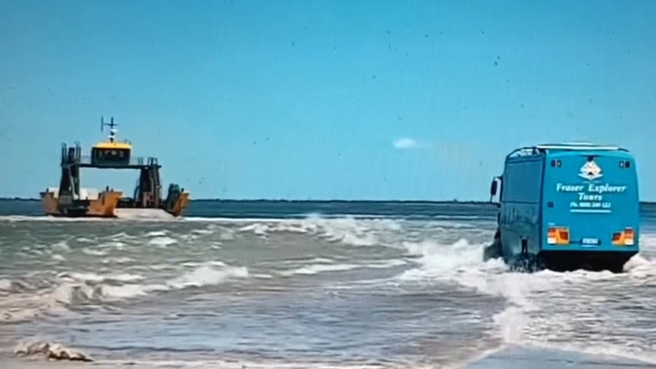 A bus wades through water at Inskip Point to reach the barge to Fraser Island in video captured by Cooloola Sails.