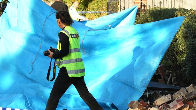 Worksafe investigators at the scene where a man died when a fence fell on him in Culbin Ave, Belmont, in May this year. Picture: Alison Wynd