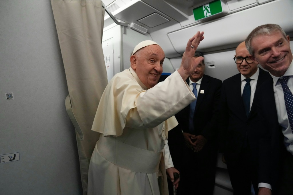 Pope Francis aboard his flight bound to Indonesia, where he will start a 12-day visit to the Asia-Pacific