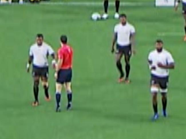 New Zealand referee gives a low-five to a Fijian after they scored and went out to a 21-12 lead over the Wallabies.