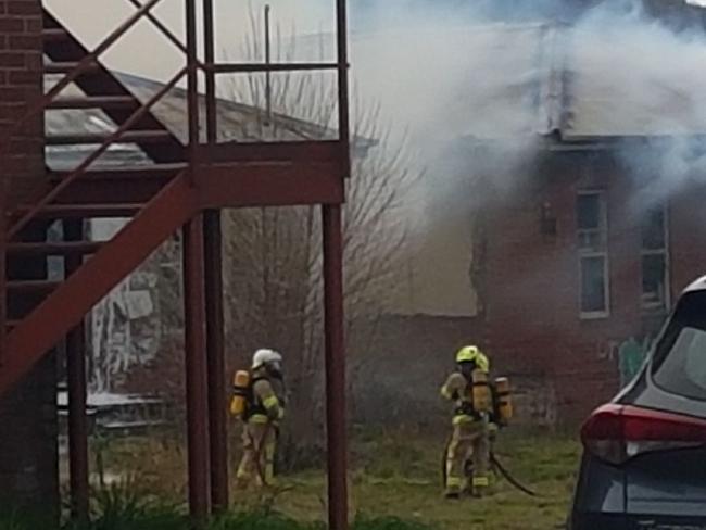 Firefighters on the scene at a fire in Glenora House at Willow Court in New Norfolk. Picture: PAUL BELCHER