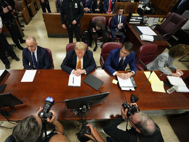 Former US President and Republican presidential candidate Donald Trump, sitting with attorneys Emil Bove (L) and Todd Blanche (R), attends his trial. Picture: AFP