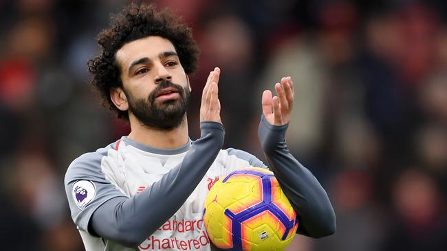 BOURNEMOUTH, ENGLAND - DECEMBER 08:  Mohamed Salah of Liverpool collects the match ball after scoring a hattrick and acknowledges the fans after the Premier League match between AFC Bournemouth and Liverpool FC at Vitality Stadium on December 8, 2018 in Bournemouth, United Kingdom.  (Photo by Mike Hewitt/Getty Images)