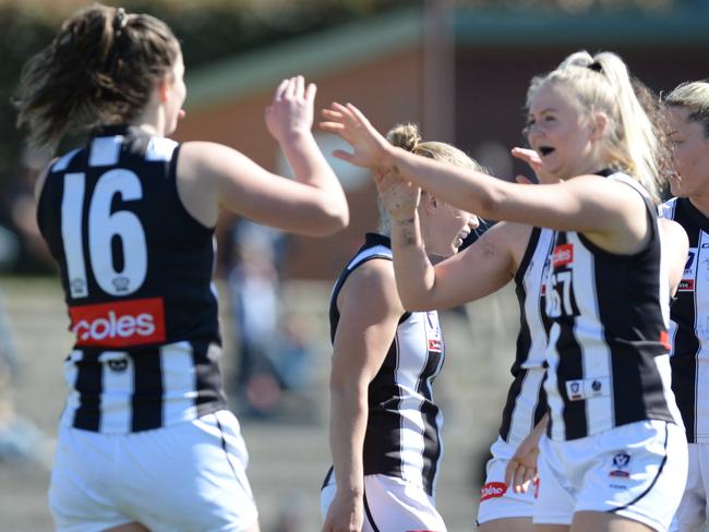 VFL Womens football: Hawthorn v Collingwood at Box Hill city oval. Collingwood players celebrate a goal with #16 Katie Lynch. Picture:AAP/ Chris Eastman