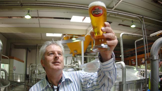 Head brewer Peter David holding schooner of new West End Draught natural beer at Lion Nathan brewery in Adelaide.