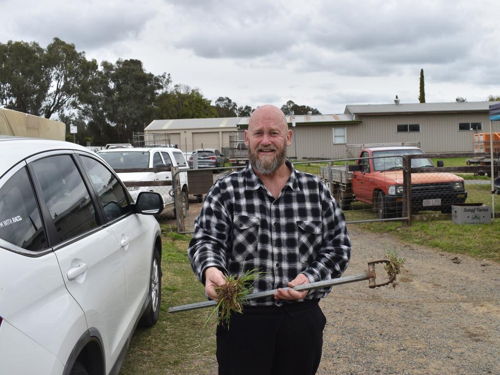 Garry Brown sells his homemade wares, including his own invention the Shark Weeder (photo: Michael Hudson/ Warwick Daily News)