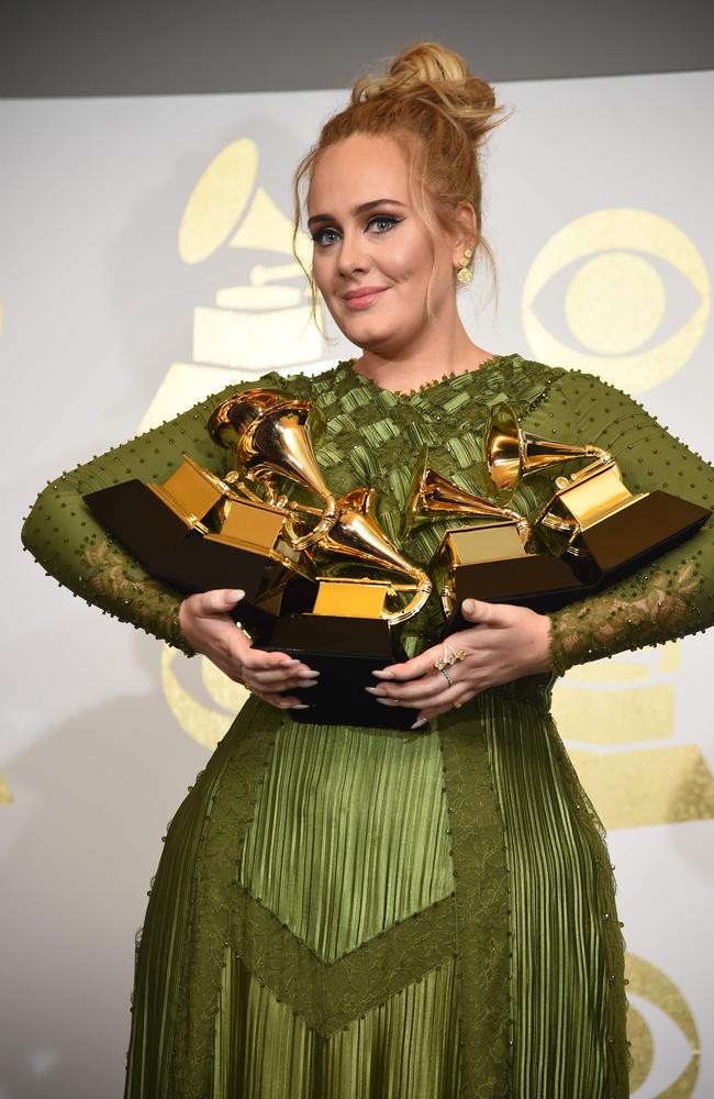 Adele with her five Grammys in 2017. Picture: Robyn Beck