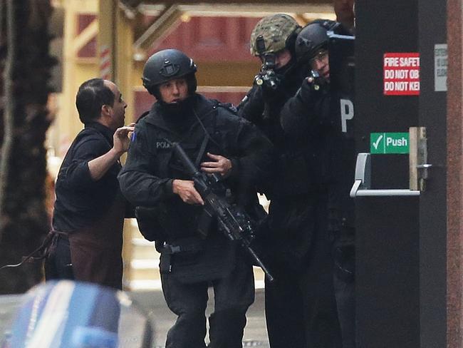 Lindt cafe worker Pablo Vassallo (pictured left) was the third hostage to escape from the Lindt cafe on December 15, 2014. Picture: by Mark Metcalfe/Getty Images