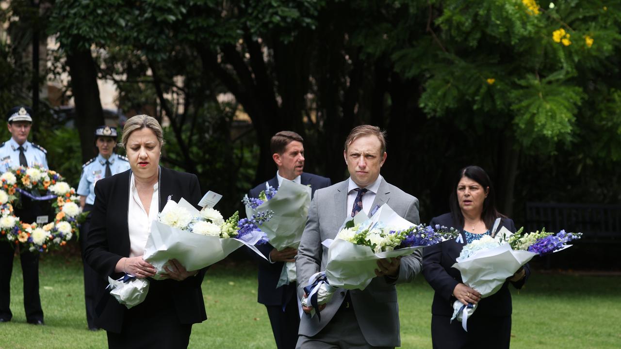 Premier Annastacia Palaszczuk , DP Steven Miles , Grace Grace and Cameron Dick laying flowers for fallen QPS officers at the Police memorial in the city Botanic Gardens. Pic Annette Dew