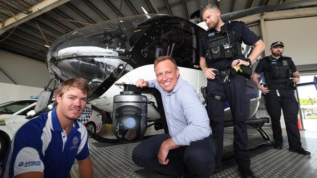 Premier Steven Miles in Townsville with the new Old Police Helicopter at Townsville Airport with camera surveillance operator, Jake Keir. Picture: Annette Dew