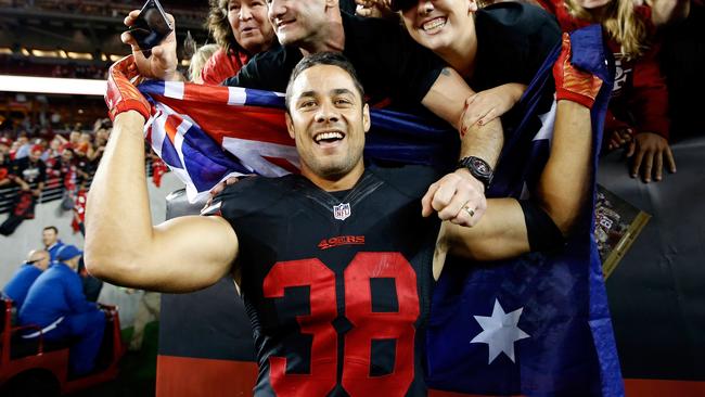 Jarryd Hayne #38 of the San Francisco 49ers poses with fans.