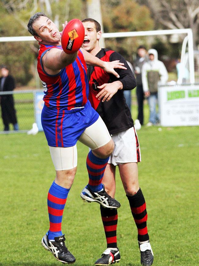 Rye champion Greg Doyle reaches for the ball.