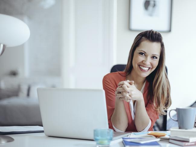 SMARTDAILY: Young woman working at home