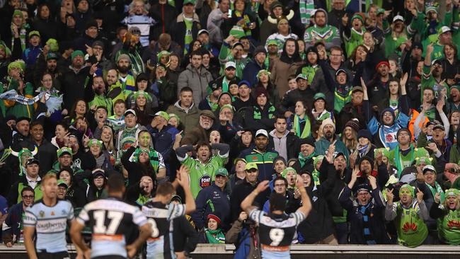 The Canberra crowd reacts to Michael Ennis as he celebrates victory.