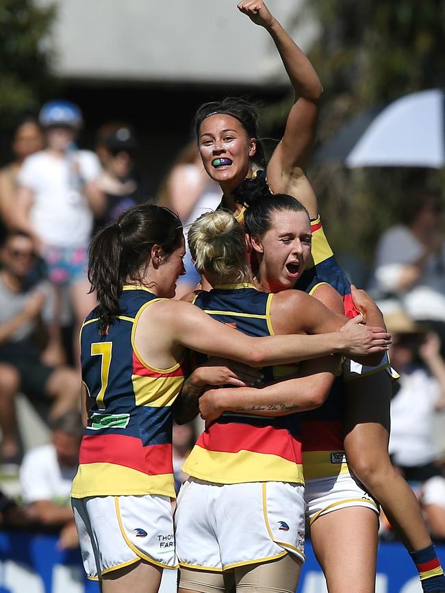 Justine Mules comes over the top to celebrate the Crows’ win Picture: Wayne Ludbey