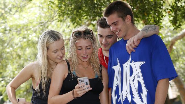 Kiara Burridge -18, Ella Wallich -18, John Dearberg -19 and Robbie Graham -18 talking about dating apps. Picture: John Appleyard