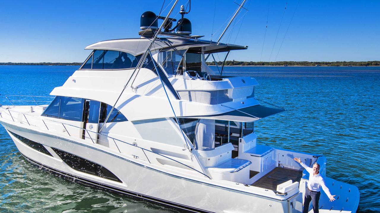 Riviera boss Rodney Longhurst with the company's new $3.2 million 64 Sports Motor Yacht. Picture: Nigel Hallett