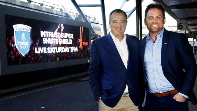 L to R: Sydney businessmen John Murray and Nick Fordham   in front of the Electronic Billboard at the Airport, advertising the Shute Shield broadcasts on 7two. Nick and John are  the men who have revived Sydney club rugby in the last three years. Picture: John Appleyard