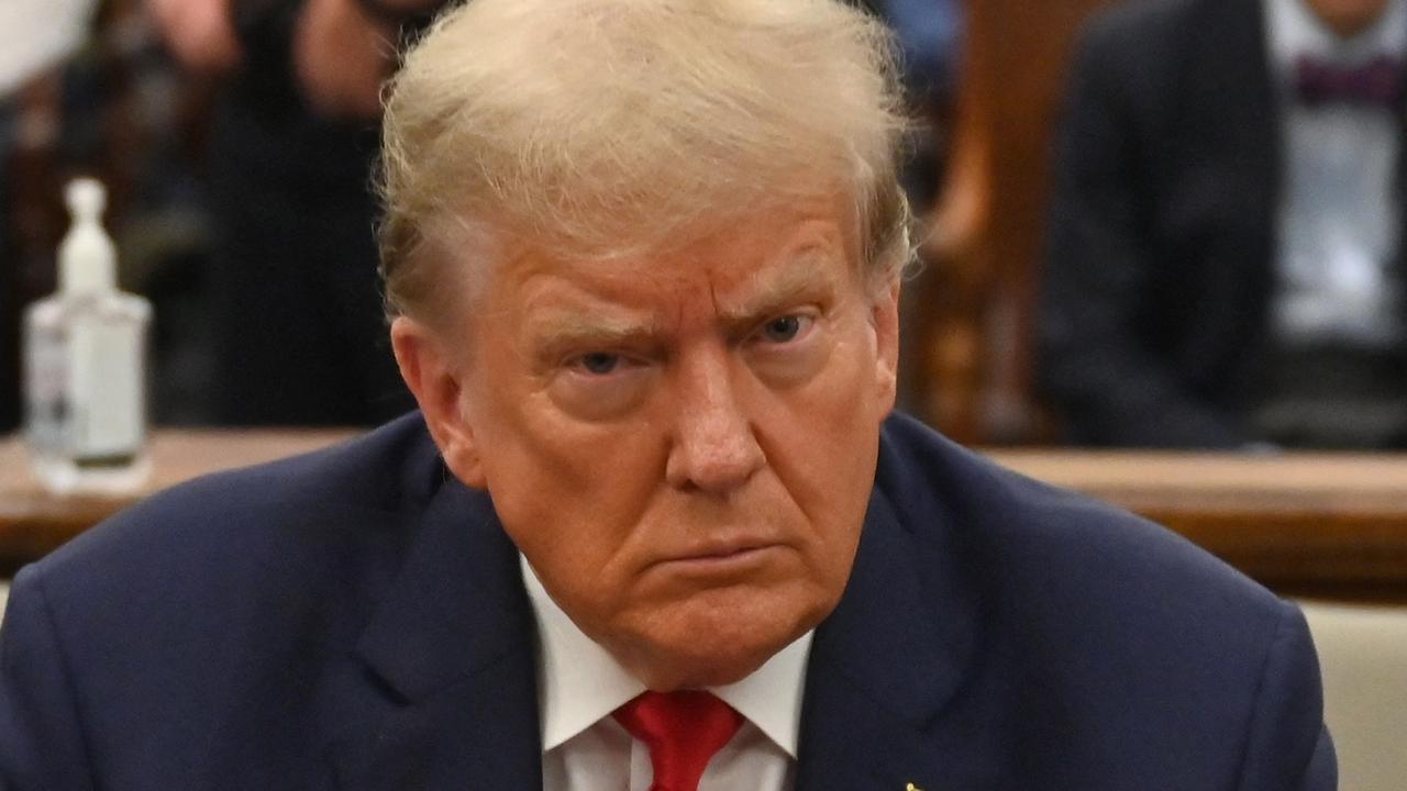 Former US President Donald Trump sits inside the courtroom for the third day of his civil fraud trial in New York on October 4, 2023. The New York judge presiding over Donald Trump's trial for allegedly covering up hush money payments linked to extramarital affairs ordered a delay on March 15, 2024 in proceedings that had been scheduled to get underway on March 25. (Photo by ANGELA WEISS / AFP)