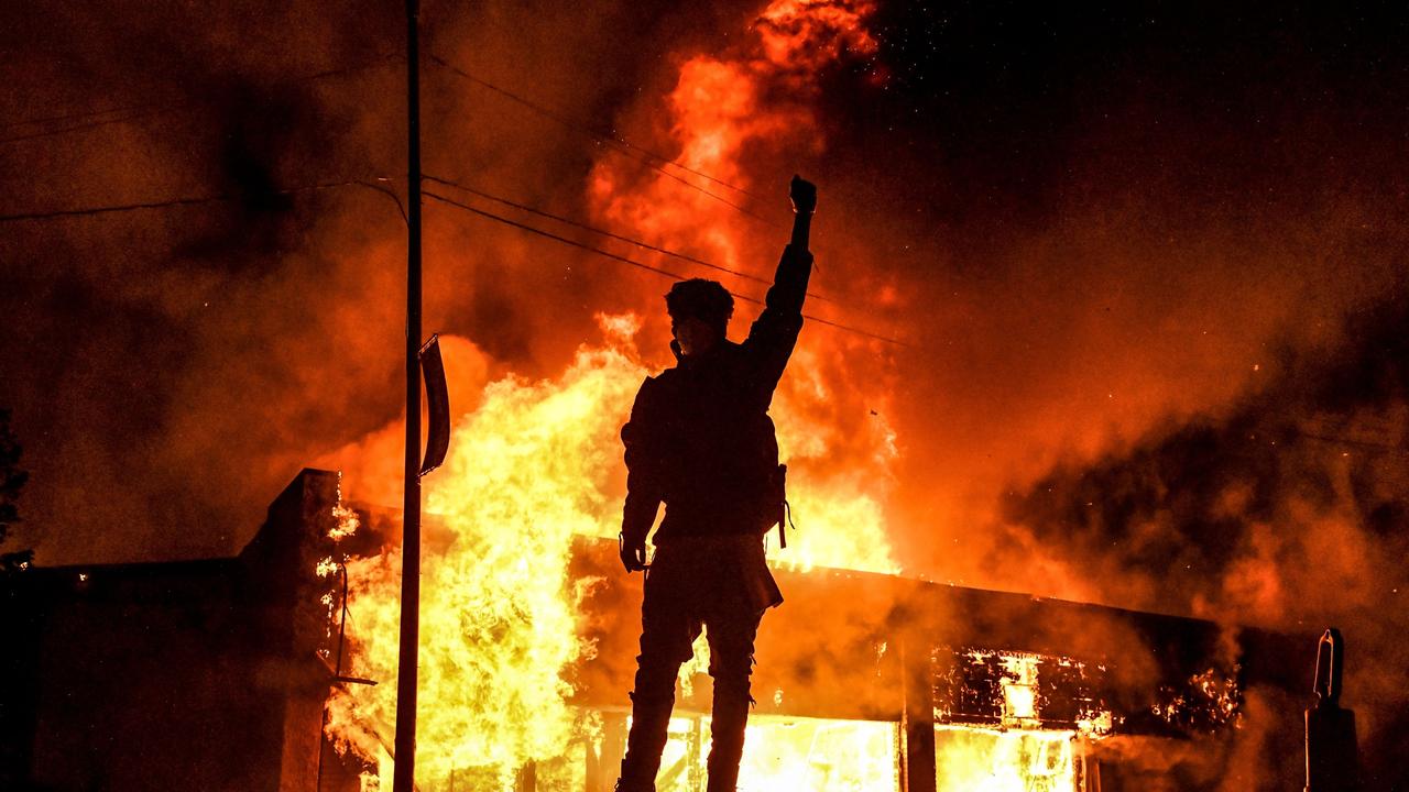 Tim Walz was governor when riots engulfed Minneapolis, Minnesota, in 2020 after the death of George Floyd. Picture: Chandan Khanna/AFP