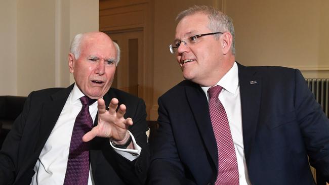 John Howard chats with Prime Minister Scott Morrison in Canberra last year. Picture: AAP