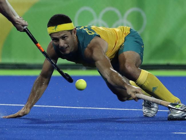 Australia's Jamie Dwyer, fights for the ball during a men's field hockey quarterfinal match against Netherlands at 2016 Summer Olympics in Rio de Janeiro, Brazil, Sunday, Aug. 14, 2016. (AP Photo/Hussein Malla)