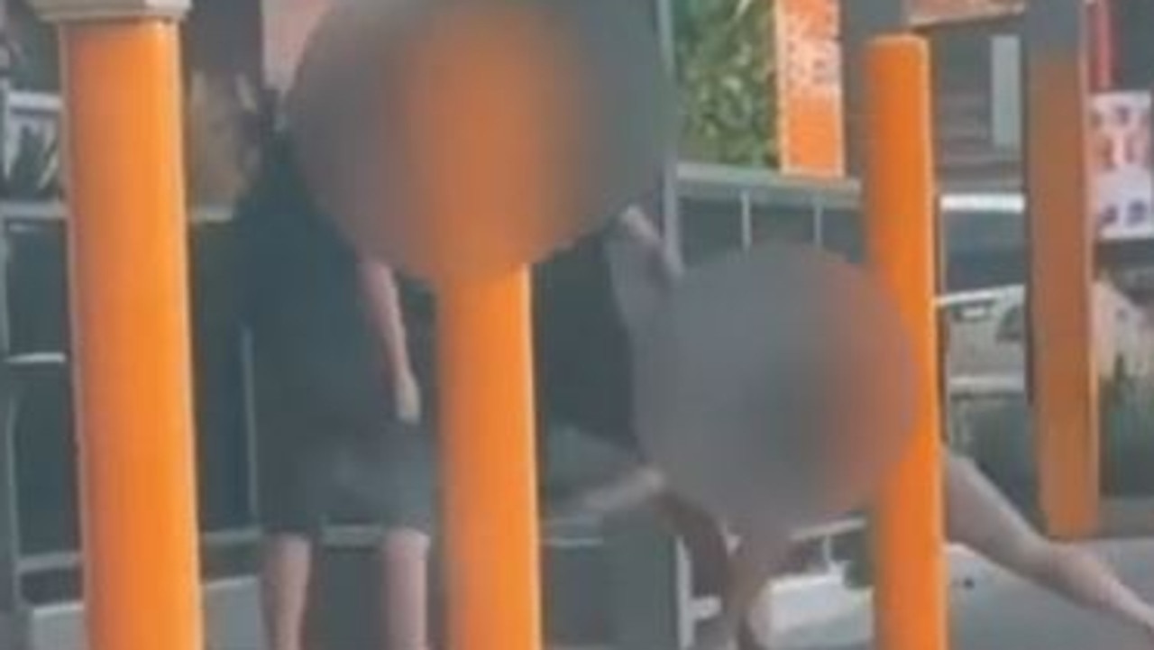 A pair has been caught on camera viciously attacking each other outside the Nambour Train Station.