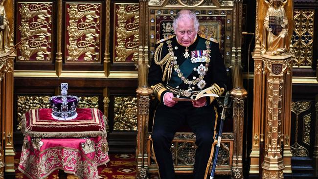 Britain's King Charles, after reading the Queen's Speech as he holds it in his hands in the House of Lords Chamber during the State Opening of Parliament at the Houses of Parliament, in London. Picture: Ben Stansall / POOL / AFP