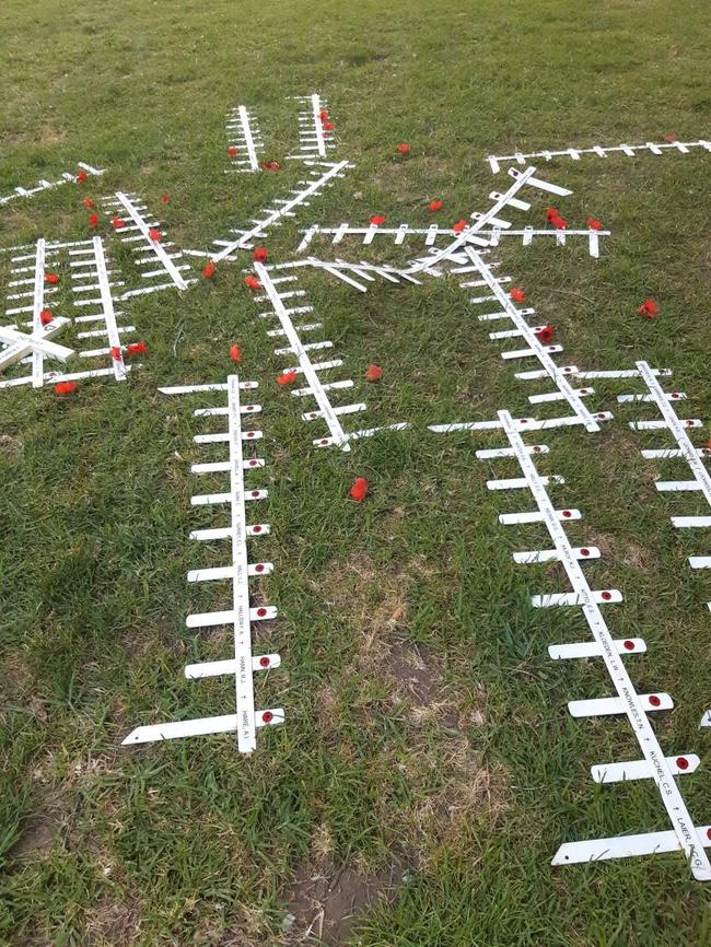 Crosses near the National War Memorial in North Terrace, Adelaide, knocked over by vandals just hours after they were planted by St Aloysius College Students for Remembrance Day.