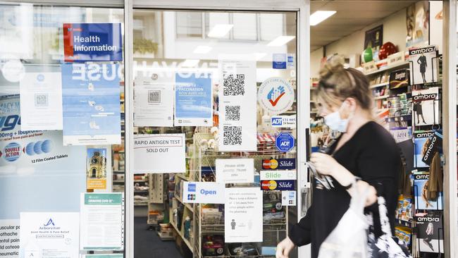 A sign on the front door of Anderson's Pharmacy, Willoughby, saying ‘Rapid Antigen Tests – Sold Out’. Picture: Dylan Robinson