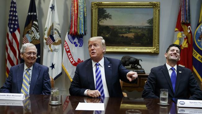 Senate Majority Leader Mitch McConnell, R-Ky., left, and Speaker of the House Rep. Paul Ryan, R-Wis., right, listen as President Donald Trump speaks during a meeting with Republican lawmakers in the Roosevelt Room of the White House, Wednesday, Sept. 5, 2018, in Washington. (AP Photo/Evan Vucci)