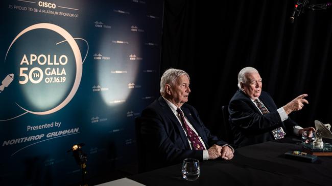 Honeysuckle Creek radio telescope trackers John Saxon (left) and Mike Dinn talk with Apollo astronauts and US staff during a live cross event.