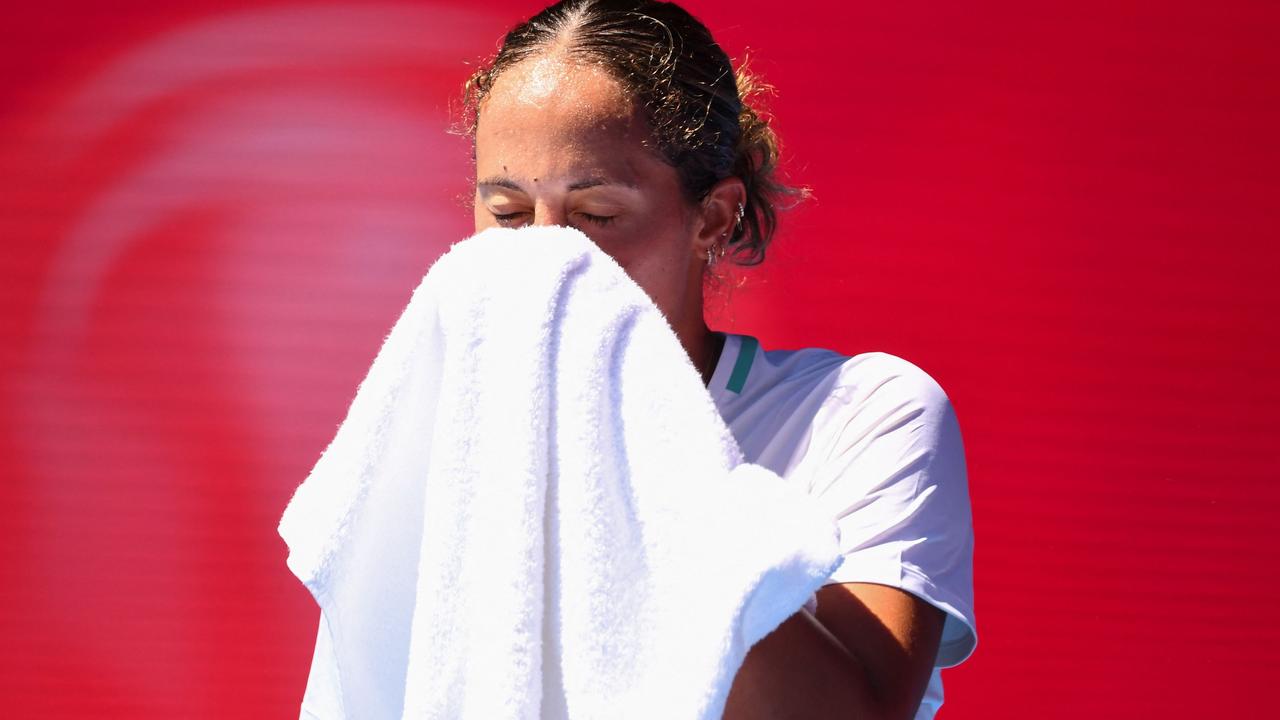 Keys wipes her face during her match on a boiling Rod Laver Arena. Picture: AFP