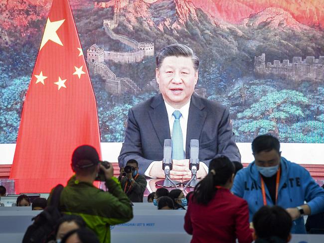 A screen shows Chinese President Xi Jinping delivering a speech via video for the opening ceremony of the 3rd China International Import Expo (CIIE) at a media centre in Shanghai on November 4, 2020. (Photo by STR / AFP) / China OUT