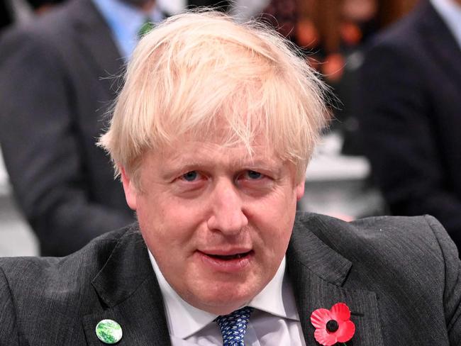 Britain's Prime Minister Boris Johnson indicates 1.5 degrees with his hands as he attends the World Leaders' Summit "Accelerating Clean Technology Innovation and Deployment" session during the COP26 Climate Conference at the Scottish Event Campus in Glasgow, Scotland on November 2, 2021. - More than 80 countries have signed up to a US and EU pledge to slash methane emissions by 30 percent by the end of the decade, European Commission head Ursula von der Leyen said Tuesday. (Photo by Jeff J Mitchell / various sources / AFP)