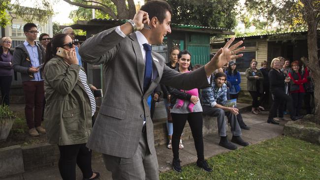 Auctioneer James Hurley during the auction of 11 Frazer St, Dulwich Hill, which sold for $1.4 million. The central bank said it did consider the very strong Sydney and Melbourne housing markets at its June meeting.