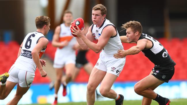 GWS young gun Tom Green looks for a handpass in Sunday’s loss.