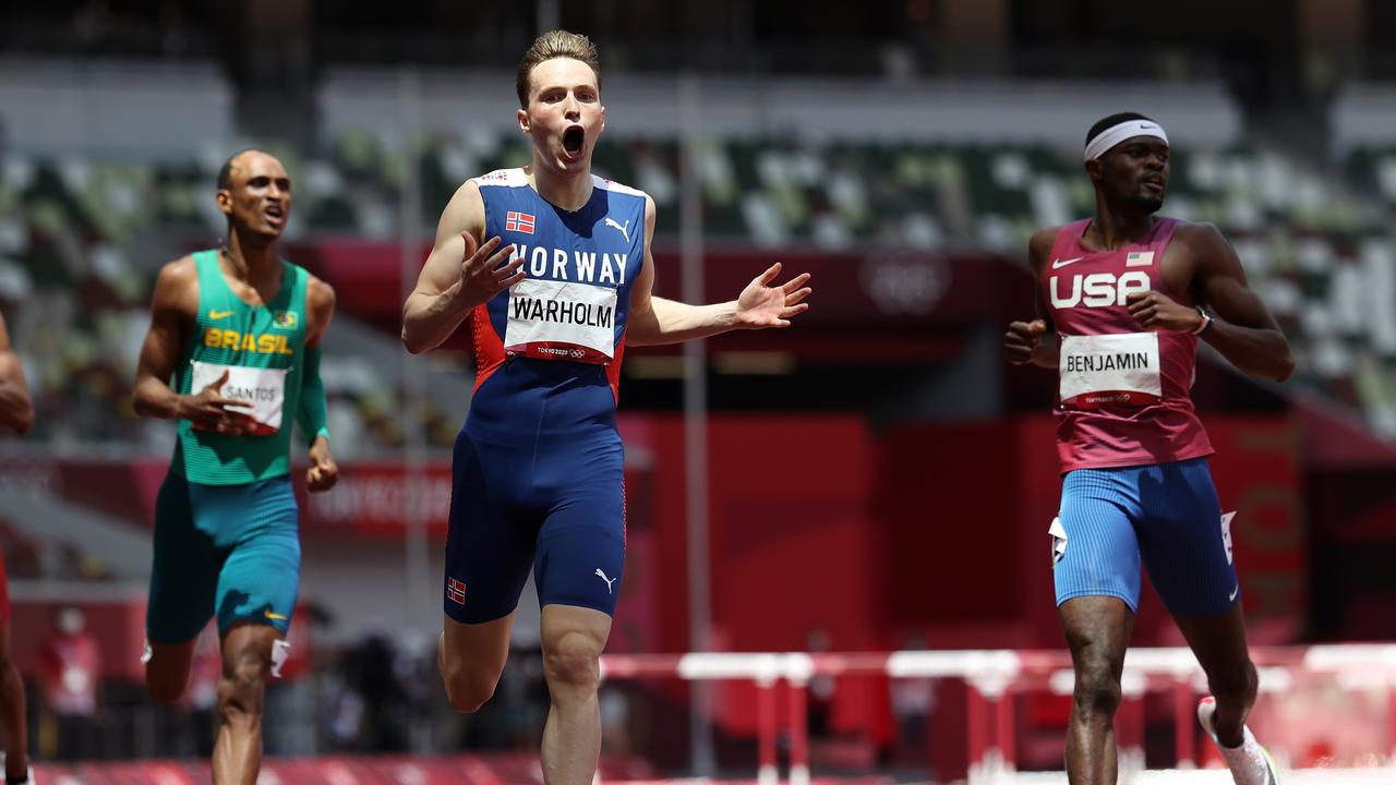 Karsten Warholm smashed his own world record to win the Olympic men’s 400 metres hurdles gold.