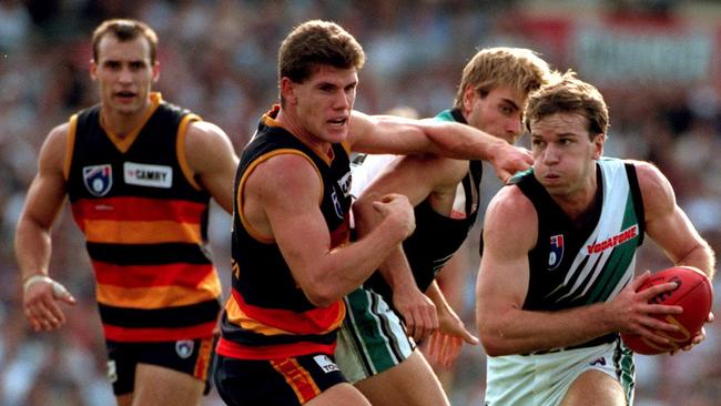 Port’s Josh Francou bursts clear of Adelaide’s Jason McCartney. Picture: Phil Hillyard