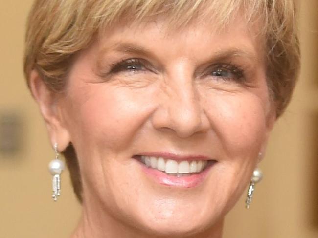 Australian Minister for Foreign Affairs Julie Bishop (L) shakes hands with the Governor-General of Australia Peter John Cosgrove (R) after her swearing-in ceremony at Government House in Canberra on July 19, 2016. Malcolm Turnbull was sworn in for another term as Australia's prime minister on July 19 after a narrow election victory with budget repair and a public vote on same sex marriage among his top priorities. / AFP PHOTO / PETER PARKS