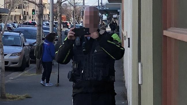 An Adelaide City Council parking inspector films parents dropping their kids off at school. Picture: David Penberthy