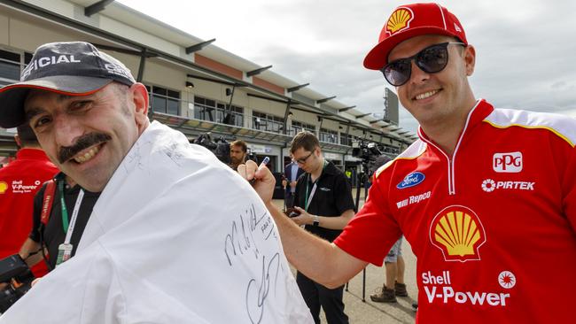 Scott McLaughlin signs a fan’s shirt in Townsville on Thursday ahead of this weekend’s Townsville 400.