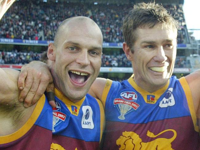 Martin Pike, Alastair Lynch and Justin Leppitsch celebrate their win. 2003 Grand Final. Collingwood v Brisbane Lions. MCG.