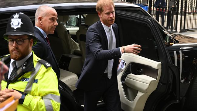 Prince Harry arrives to give evidence at the trial.