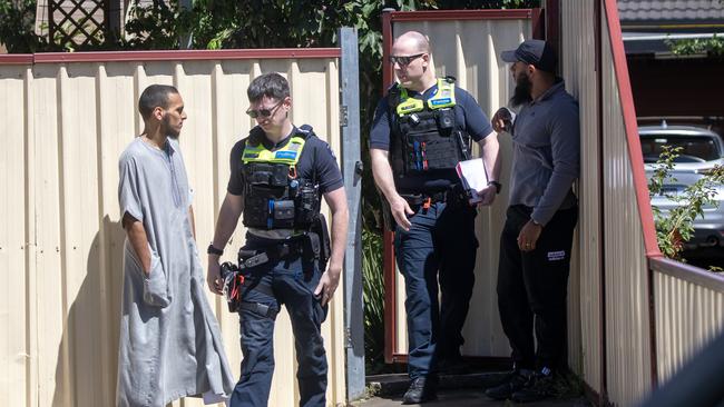 Police enter the home where Abdul Benbrika is required to reside. Picture: Liam Mendes/The Australian