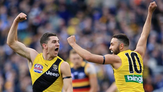 Jason Castagna  and Shane Edwards celebrate a third-quarter goal. Picture: Mark Stewart